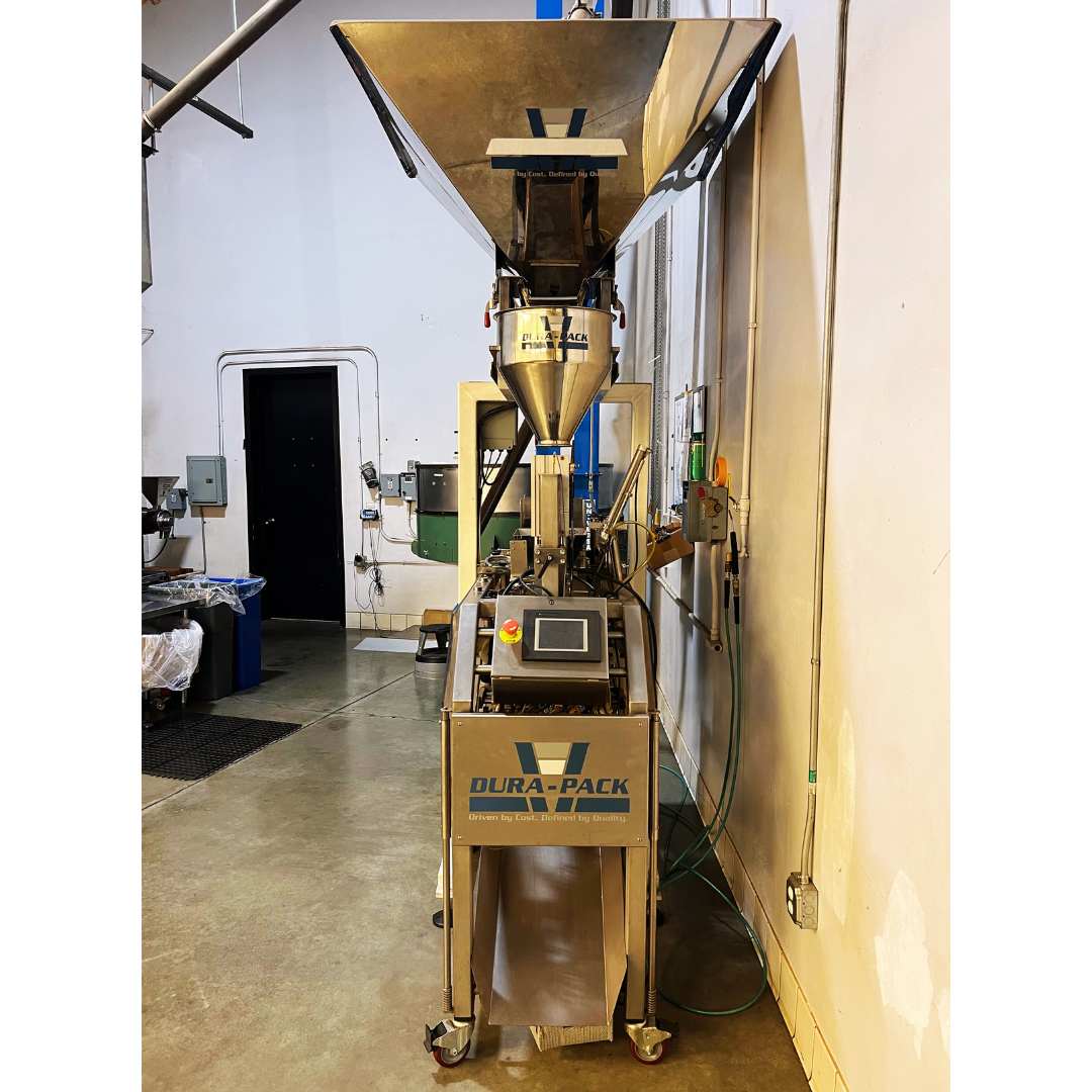Front view of Dura-Pack M7 pouching machine, used coffee equipment, capable of high-speed coffee packaging with premade pouches.