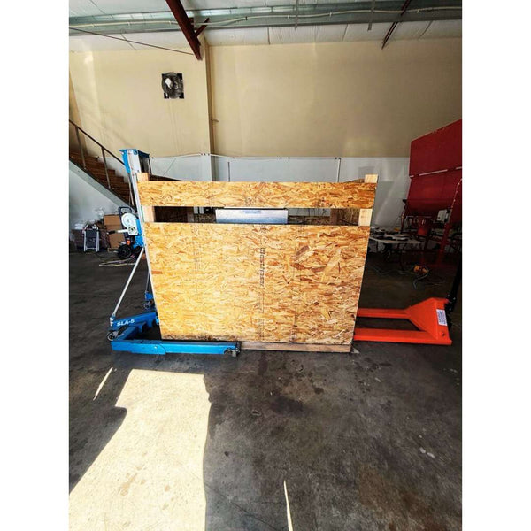 Crated version of 2023 Youlian QLF-1680 vertical band coffee bag sealer, used coffee equipment in excellent condition, ready for high-volume packaging.