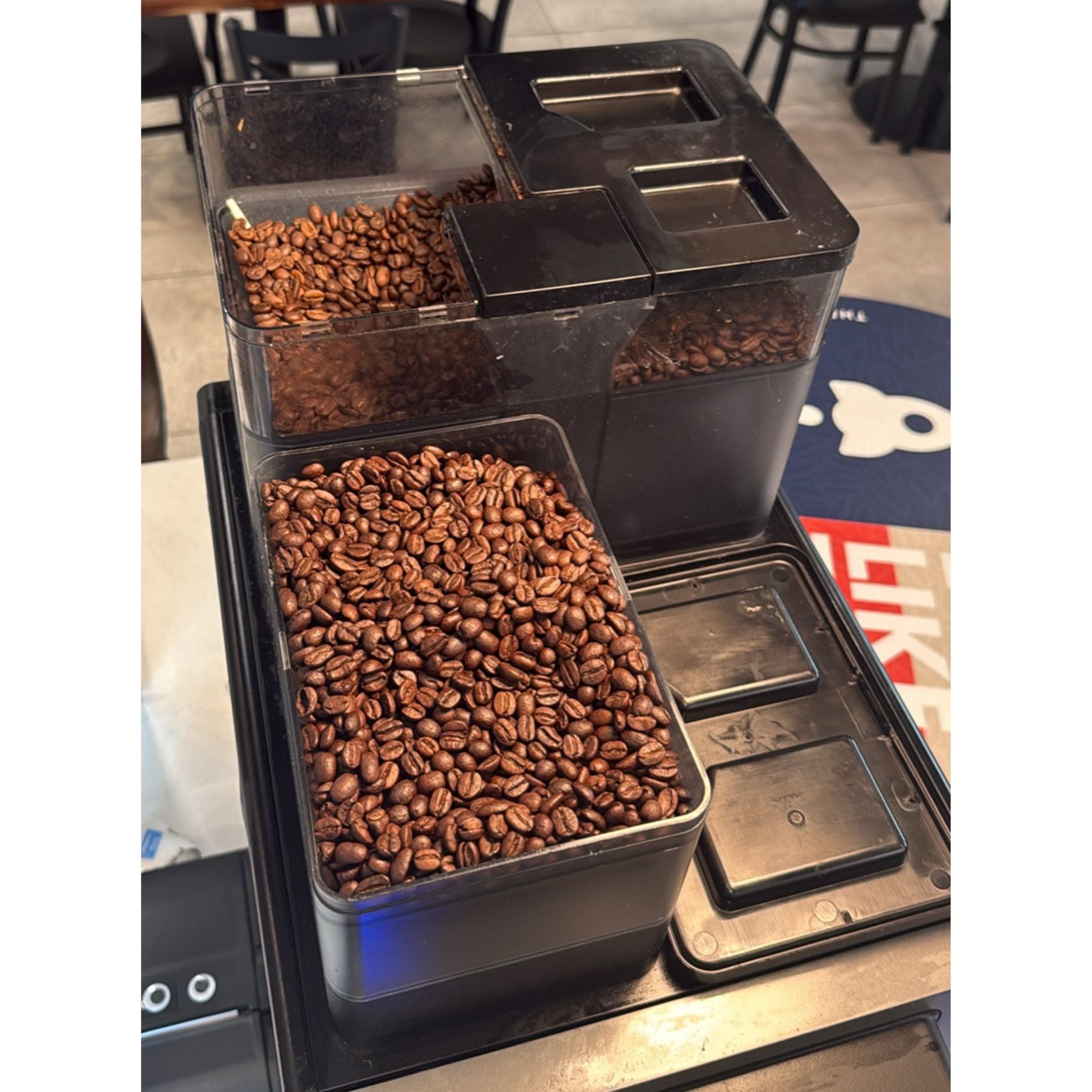 2023 Franke S700 used espresso machine view looking top down into the dual coffee bean holding compartments