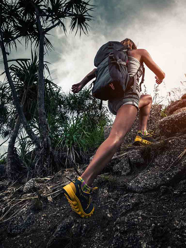 photo of woman hiking up a hill to represent that Coffee Equipment Pros goes the extra mile for its customers